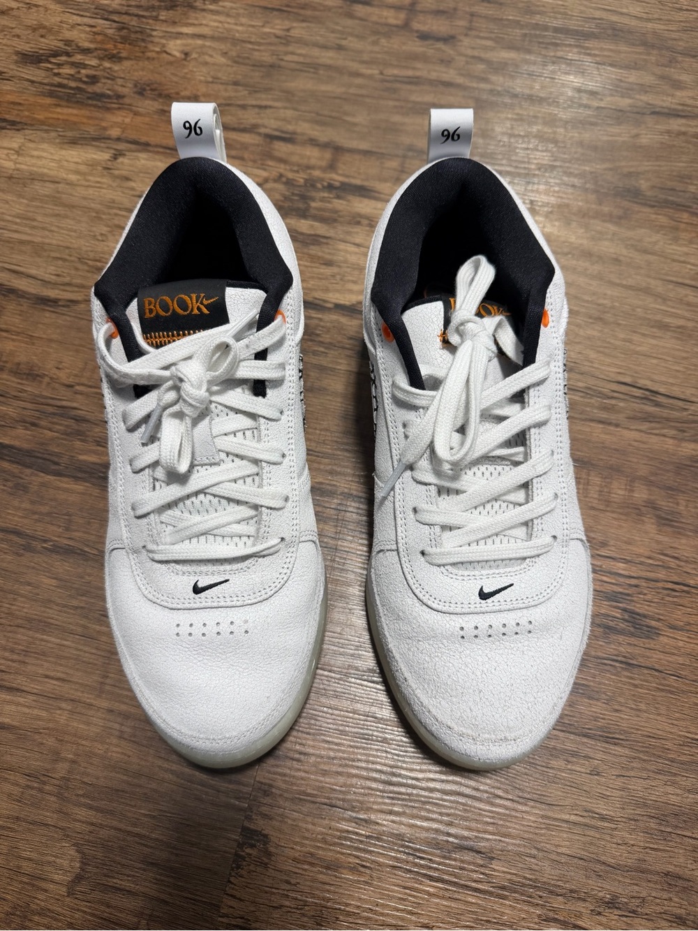Nike White Sneakers with Black and Orange Details